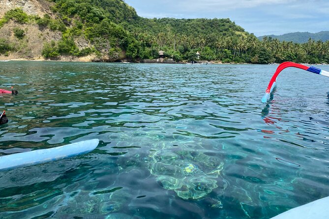 Bali Snorkeling at Blue Lagoon with Waterfall Include Lunch - Tibumana Waterfall: jungle path, wooden bridge, and shallow-water relief