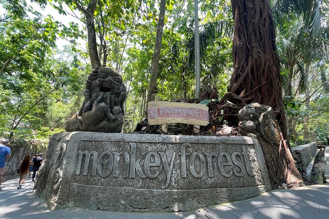 Rafting Swing Monkey Forest And Waterfall Tour All Inclusive - Sacred Monkey Forest Sanctuary: wooden bridges, long-tail monkeys, and old statues